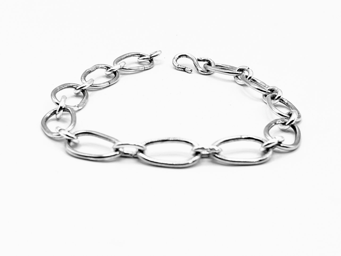 Radiant Linkage: Handcrafted Sterling Silver Oval Chain Bracelet