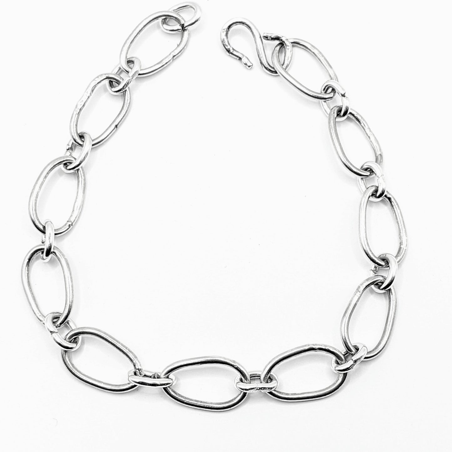 Radiant Linkage: Handcrafted Sterling Silver Oval Chain Bracelet