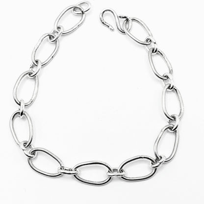 Radiant Linkage: Handcrafted Sterling Silver Oval Chain Bracelet