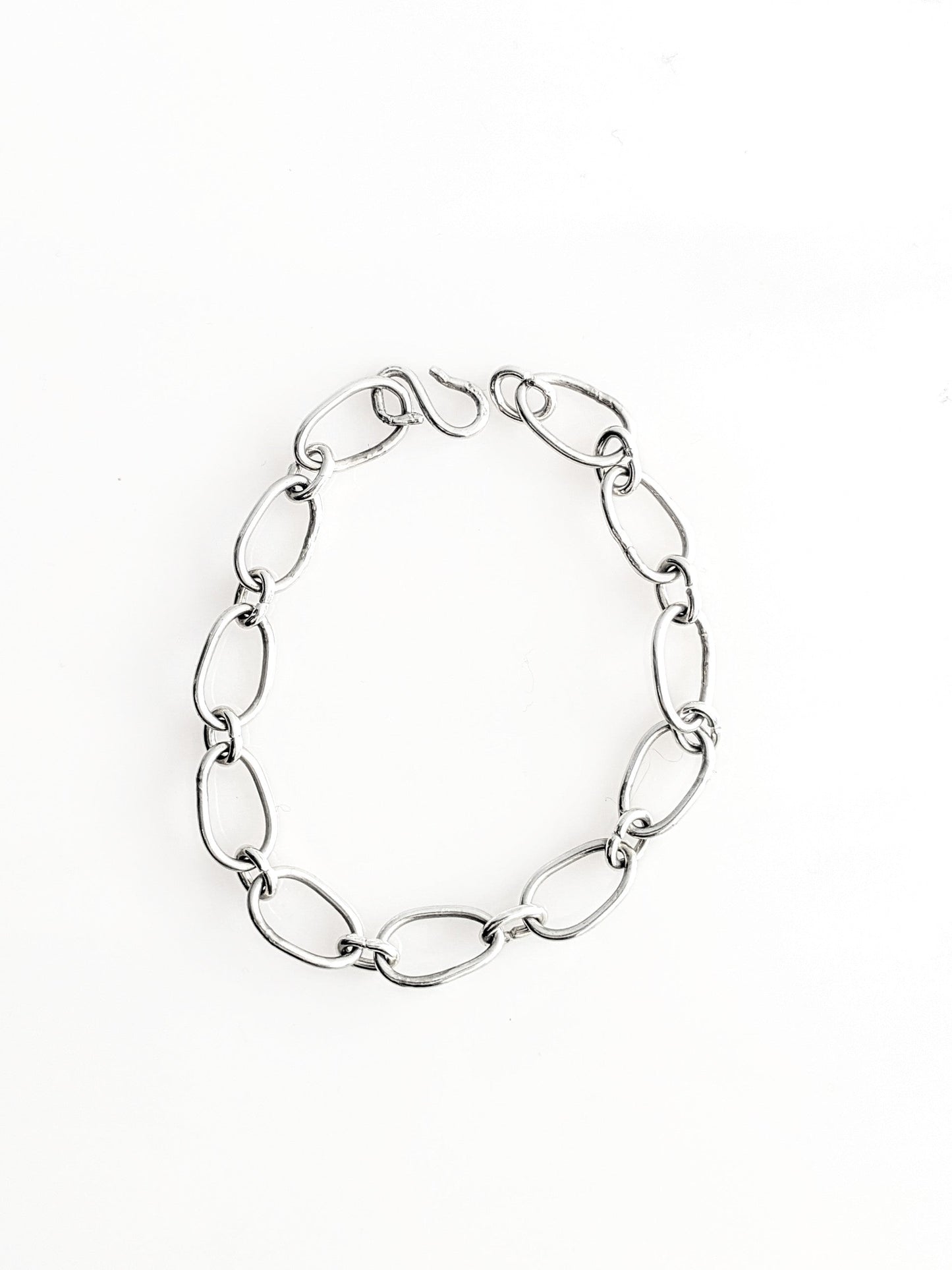Radiant Linkage: Handcrafted Sterling Silver Oval Chain Bracelet